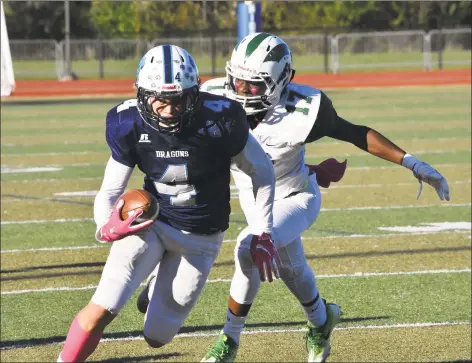  ?? Pete Paguaga / Hearst Connecticu­t Media ?? Middletown’s Kyle Despres carries against Maloney during the Blue Dragons’ 3421 loss on Friday in Middletown.