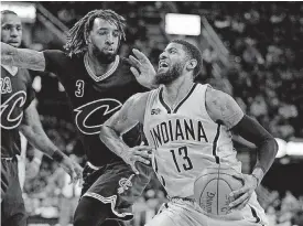  ??  ?? Indiana Pacers’ Paul George, right, remained with the team after the trade deadline passed Thursday.
[AP PHOTO]