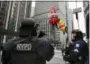  ?? JULIE JACOBSON — THE ASSOCIATED PRESS FILE ?? New York Police counterter­rorism personnel watch as the Macy’s Thanksgivi­ng Day parade makes its way down Sixth Avenue in New York in 2016.