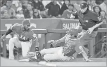  ?? Robert Gauthier Los Angeles Times ?? SHOHEI OHTANI of the Angels steals third base in the fourth inning, just ahead of a tag by Jurickson Profar of the Rangers.