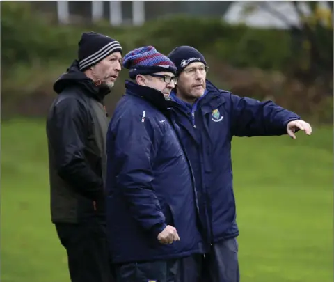  ??  ?? Wicklow Senior hurling coach Michael Neary makes a point to manager Seamus Murphy and selector Michael Anthony O’Neill during the Wicklow v Meath friendly clash in Bray last Sunday morning. Photo: Barbara Flynn
