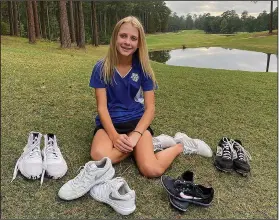  ?? Hillary Frisby/Special to News-Times ?? Shoe shopper: Parkers Chapel freshman Bella Frisby wears a lot of different shoes as a five-sport athlete. Frisby and the Lady Trojans will compete in the 2A State Golf Tournament today in Horsehoe Bend.
