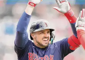  ?? Carlos Osorio/Associated Press ?? Boston Red Sox’s Adam Duvall is greeted at home plate after his three-run home run during the sixth inning against the Detroit Tigers Thursday in Detroit.