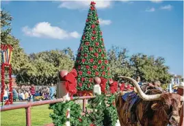  ?? Visit Fort Worth via Austin American-Statesman ?? Western-themed magic unfolds at Christmas in the Stockyards in Fort Worth.