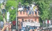  ?? PTI ?? Aligarh Muslim University students stage a protest over Jinnah portrait issue on Friday.