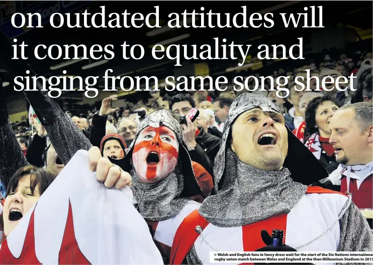  ??  ?? > Welsh and English fans in fancy dress wait for the start of the Six Nations internatio­nal rugby union match between Wales and England at the then Millennium Stadium in 2013