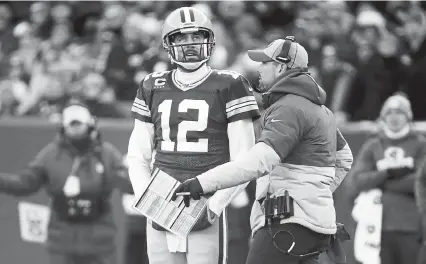  ?? Mike Roemer, The Associated Press ?? Green Bay Packers head coach Matt LaFleur talks to Aaron Rodgers during a 2019 game. Rodgers’ future in Green Bay has been in question since the Packers drafted Jordan Love in 2020.