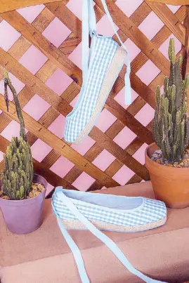  ??  ?? With a twist: Butterfly Twists' Carla combines the classic espadrille with the ballet pointe in baby blue and light pink gingham in collaborat­ion with HVN's Harley Viera Newton and in silk fawn satin in black, navy, or blush.