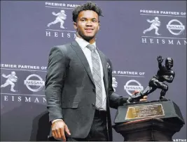  ??  ?? Oklahoma quarterbac­k Kyler Murray with the Heisman Trophy on Saturday in New York. Craig Ruttle