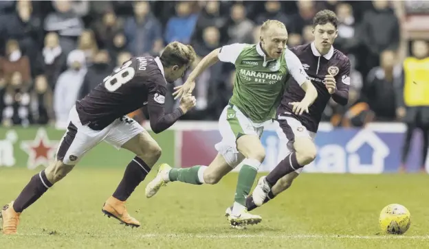  ??  ?? Dylan Mcgeouch, pictured in action for Hibs against capital rivals Hearts last season, is poised to join former St Mirren manager Jack Ross at the Stadium of Light.