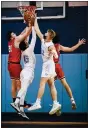  ?? JAMES BEAVER — FOR MEDIANEWS GROUP ?? Souderton’s Aleks Smith (21) reaches up for a rebound with North Penn’s Tehran Wright (45) and Josh Jones (23) battling for position during their game on Tuesday, Jan. 19, 2021.