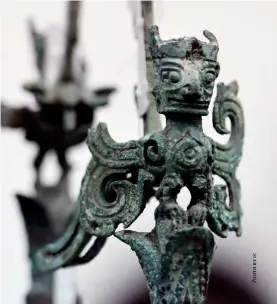  ??  ?? A bronze figurine unearthed from Sanxingdui is displayed at Sanxingdui Museum, Guanghan, Sichuan Province, April 8, 2021