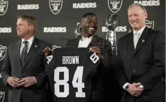  ?? AP ?? New Oakland general manager Mike Mayock, right, said Antonio Brown was not initially in the team’s free agent plans. It took about a day for Mayock and coach Jon Gruden, left, to make him a Raider.