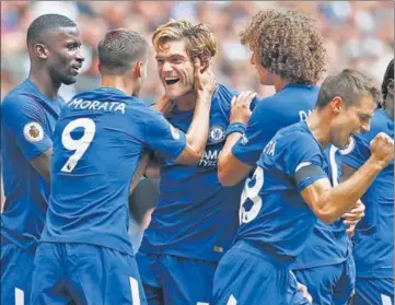  ??  ?? Chelsea’s Marcos Alonso (third left) is congratula­ted by teammates for his goal against Tottenham at the Wembley Stadium on Sunday.