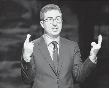  ?? Charles Sykes Invision/Associated Press ?? IN 2014, a net neutrality segment on John Oliver’s HBO show went viral, helping spur an outpouring of public comments that led the FCC to enact tough rules protecting the free f low of online content. Above, Oliver in ’15.