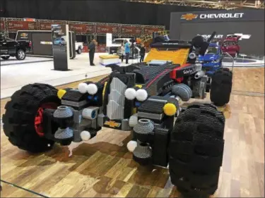  ?? DAVID S. GLASIER — THE NEWS-HERALD ?? The Lego Batmobile, composed of 335,000 Lego pieces, is one of the featured vehicles at the 2017 Cleveland Auto Show.