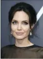  ?? PHOTO BY JORDAN STRAUSS — INVISION — AP, FILE ?? Angelina Jolie wears Forevermar­k Diamond earrings at the 75th annual Golden Globe Awards in Beverly Hills