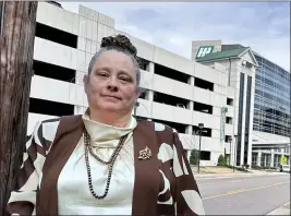  ?? AMANDA SHAVERS — THE CULLMAN TIMES VIA AP ?? Dana Holladay-Hollifield poses for a photo in front of Hunstville Hospital, in Huntsville, Ala., Feb. 27. Holladay-Hollifield has worked as a nurse in Alabama for years, but never was her pay as low as it was at Huntsville Hospital.