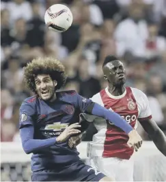  ??  ?? 0 Marouane Fellaini, left, and Davinson Sanchez go for a header.