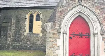  ??  ?? St David’s Church in Maesteg has suffered repeated vandal attacks and five windows are now boarded up