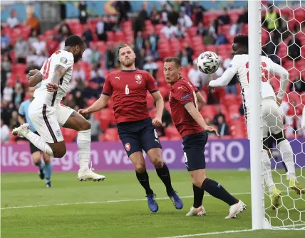  ?? Picture: Laurence Griffiths/PA ?? England’s Raheem Sterling, left, scores his side’s decisive goal during last night’s Euro 2020 group D match against the Czech Republic at Wembley