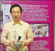  ??  ?? STAR columnist Wilson Lee Flores poses with his trophy after winning the Best Opinion Column award at the 37th Catholic Mass Media Awards held at the Star Theater in Pasay City on Wednesday.