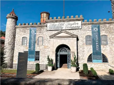  ?? AP Photo/Bruce Schreiner ?? ■ The Old Taylor distillery’s towering limestone castle is seen Sept. 14 in Millville, Ky. The structure underwent a massive rehabilita­tion after decades of neglect and was renamed Castle &amp; Key Distillery. Four years after purchasing the property, owners Will Arvin and Wes Murry have poured millions of dollars into the project and resumed spirits production. On Wednesday, the pair reopened the grounds to visitors.