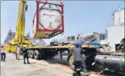  ?? AFP ?? Navy personnel unload liquid medical oxygen tanks supplied by French company as Covid relief to India, in Mumbai on May 10.