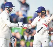  ??  ?? England's Mark Stoneman (R) celebrates with teammate James Vince during day three of the second cricket Test against New Zealand at Hagley Oval in Christchur­ch on Sunday.