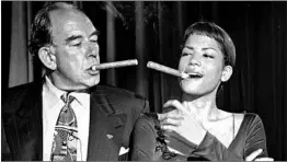  ?? AUBREY REUBEN/AP ?? Robin Leach, host of the “Lifestyles of the Rich and Famous” series, and model Veronica Webb at a 1994 party hosted by Cigar Aficionado magazine in New York.