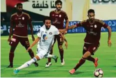  ?? Abdul Rahman/Gulf News ?? Sultan Al Ghafri of Al Wahda and Mohammad Jamal of Al Jazira fight for the ball during the Arabian Gulf League match at Al Nahyan Stadium in Abu Dhabi on Friday night.