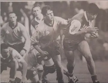  ??  ?? David Whelan of Baltinglas­s comes away with the ball from Dunlavin’s Thomas English.