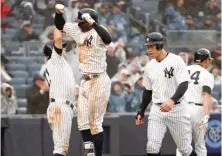  ?? AP PHOTO ?? HAPPY DANCE: Didi Gregorius leaps in the air to celebrate his three-run homer in the third inning of the Yanks’ win in their home opener yesterday.