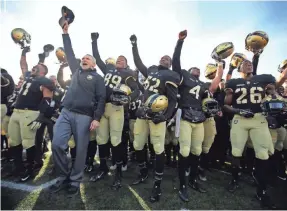  ??  ?? Army head coach Jeff Monken celebrates with his players after defeating Duke on Nov. 11 in West Point, N.Y. DANNY WILD/USA TODAY SPORTS