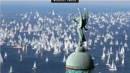  ?? | Reuters ?? SAIL boats gather at the start of the Barcolana regatta at Trieste harbour, Italy, yesterday.