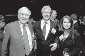  ?? Donald Bowers Getty Images for Fortune ?? WARREN BUFFETT, left, and Jamie Dimon, center, shown in 2012, are encouragin­g public companies to move away from providing quarterly guidance.