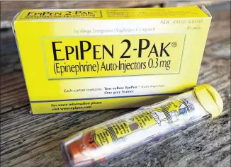  ?? AP ?? According to the Justice Department, Mylan paid Medicaid too-low rebates for EpiPens by improperly classifyin­g the brand-name product as a generic. Drugmakers are required to pay Medicaid rebates of 13 percent for generic products it purchases, versus a 23.1 percent rebate for brand-name drugs.