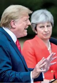  ??  ?? US President Donald Trump (L) gestures as he speaks next to Britain's Prime Minister Theresa May (R). AFP