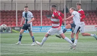  ?? ?? Aidan Nesbitt fires home Falkirk’s second goal against Hamilton.