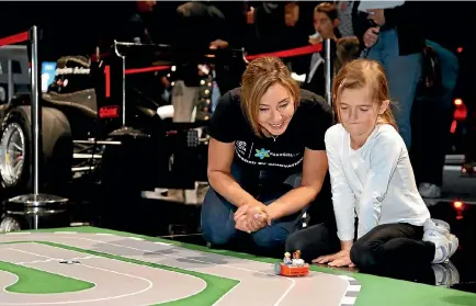  ?? PHOTO: MONIQUE FORD/FAIRFAX NZ ?? Michelle Dickinson, aka Nanogirl, taught Wellington children to code their own self-driving car during a recent workshop in the capital.