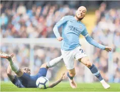  ?? — AFP photo ?? Manchester City’s David Silva vies with Fulham’s Jean Michael Seri in their English Premier League match in Manchester in this Sept 15 file photo.