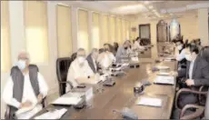  ?? -APP ?? ISLAMABAD
Federal Minister for Finance and Revenue, Shaukat Tarin, chairing a meeting of the National Price Monitoring Committee to review the price trend of essential items at the Finance Division.