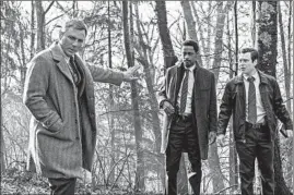  ?? LIONSGATE ?? A scene from “Knives Out,” a Trump-era spin on Agatha Christie whodunits, with Daniel Craig, from left, LaKeith Stanfield and Noah Segan as detectives on the case.