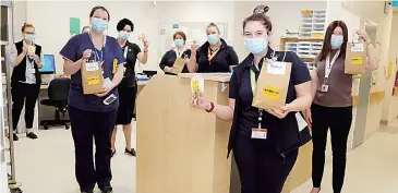  ??  ?? Receiving a surprise gift packet on R U OK? Day are West Gippsland Healthcare Group staff (back, from left) Tess Symes, Lisa Waters, Kelly Bethune, Geraldine Freriks, Lauren Miller, (front, from left) Bonnie Goris, Ruby Visalli and acting deputy clinical operations Bernie McKenna.