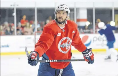  ?? AP PHOTO ?? Washington Capitals left wing Alex Ovechkin of Russia skates during practice Saturday in Arlington, Va. Ovechkin is having fun, scoring goals, leading the Capitals to the Stanley Cup Final and destroying the bad rep some laid on him for not being able...