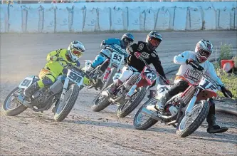  ?? BERND FRANKE THE ST. CATHARINES STANDARD ?? Chris Evans (15) leads Dustin Brown (91), Doug Lawrence (73) and Don Taylor (53) into a turn in the 450 Expert motorcycle racing class at Welland County Speedway Saturday night in Welland.