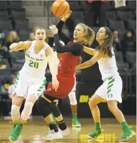  ?? Brian Davies / Associated Press ?? Oregon’s Sabrina Ionescu (20) strips the ball from Southern Utah’s Ashley Larsen. Ionescu, a Miramonte-Orinda alum, has seven career triple-doubles.