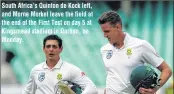  ??  ?? South Africa’s Quinton de Kock left, and Morne Morkel leave the field at the end of the First Test on day 5 at Kingsmead stadium in Durban, on Monday.