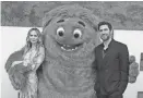  ?? ANGELA WEISS, AFP VIA GETTY IMAGES ?? John Krasinski, right, says he and his wife, Emily Blunt, got “two thumbs up” from their daughters on “IF.” Blunt voices a unicorn in the movie.