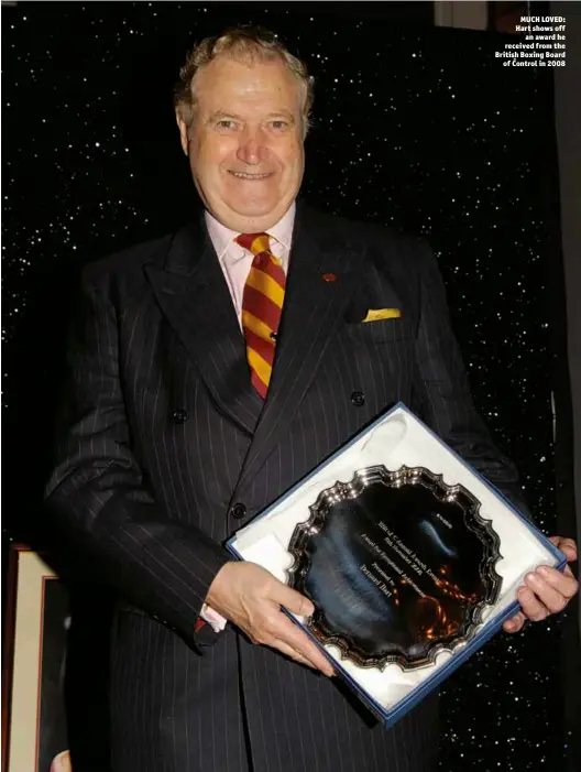  ?? Photo: PHILIP SHARKEY ?? MUCH LOVED: Hart shows off an award he received from the British Boxing Board of Control in 2008